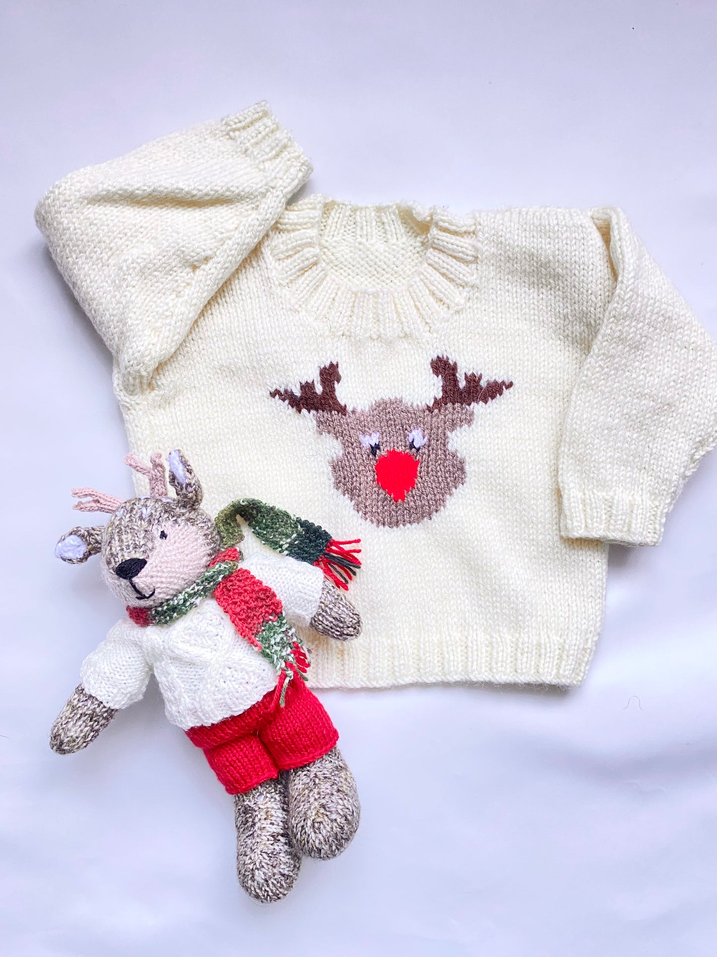 Hand knitted reindeer with cable jumper and scarf