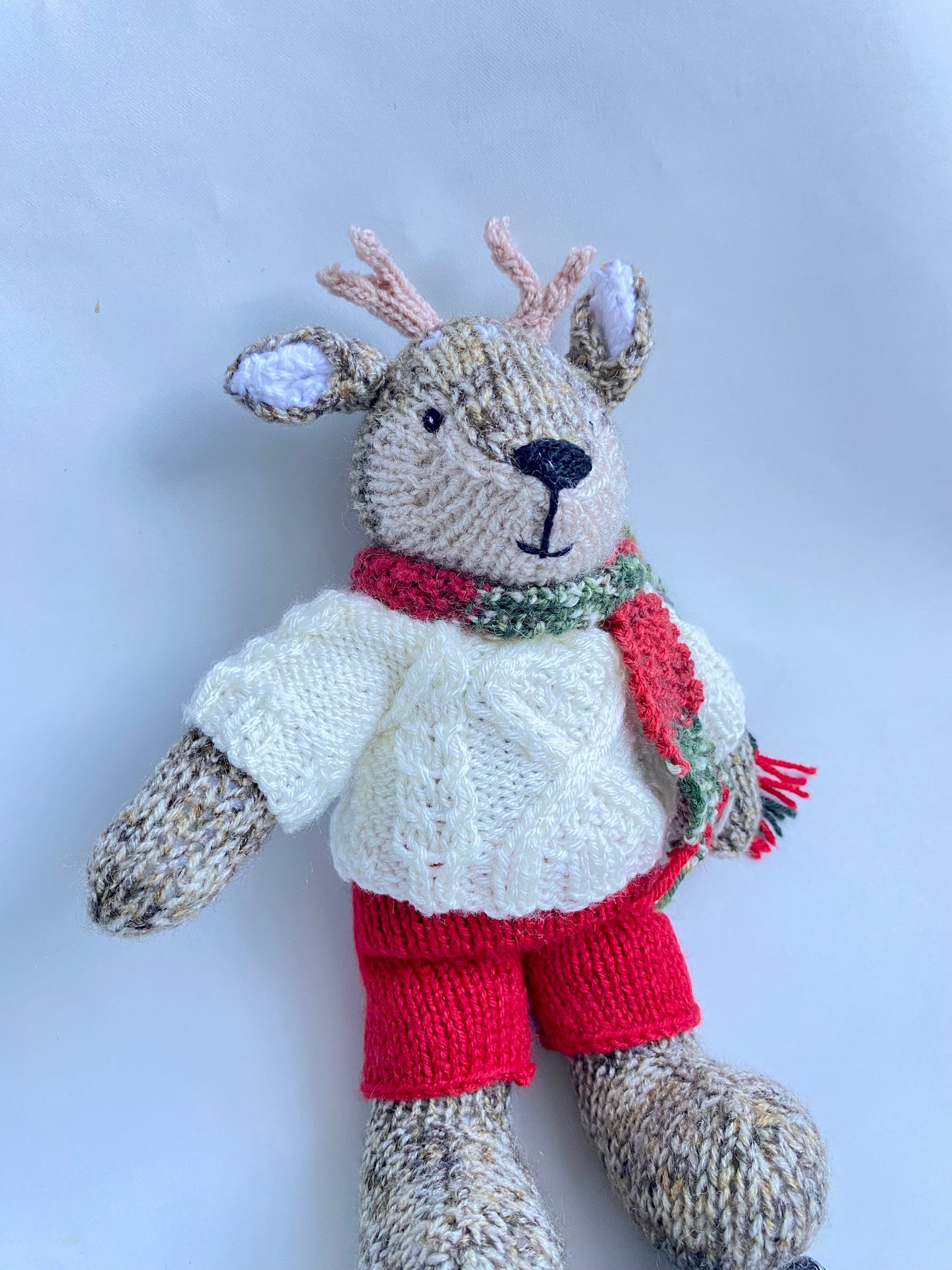 Hand knitted reindeer with cable jumper and scarf