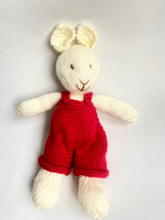 Hand knitted Bunny in red dungarees