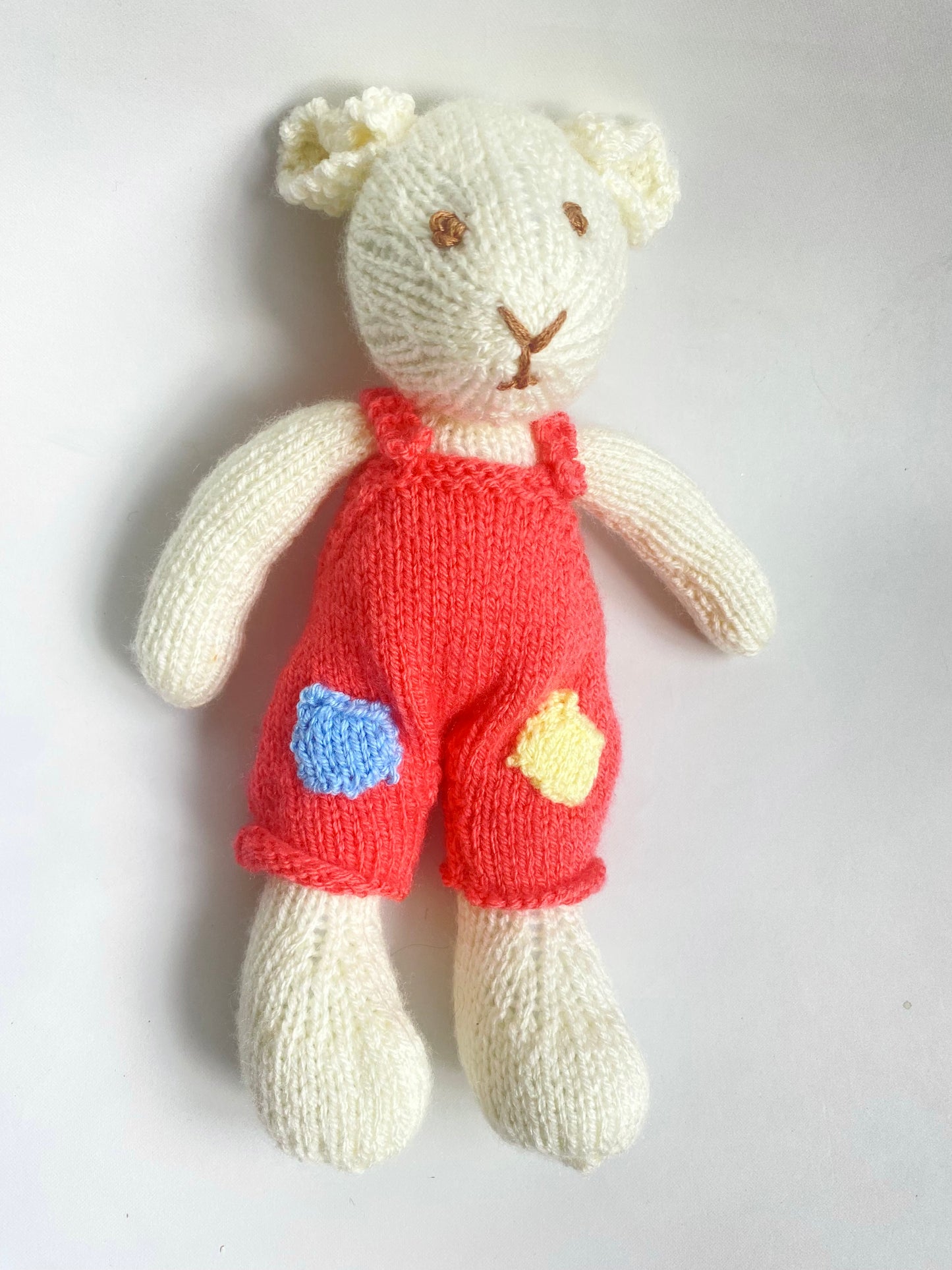 Hand knitted Mouse in coral pink dungarees