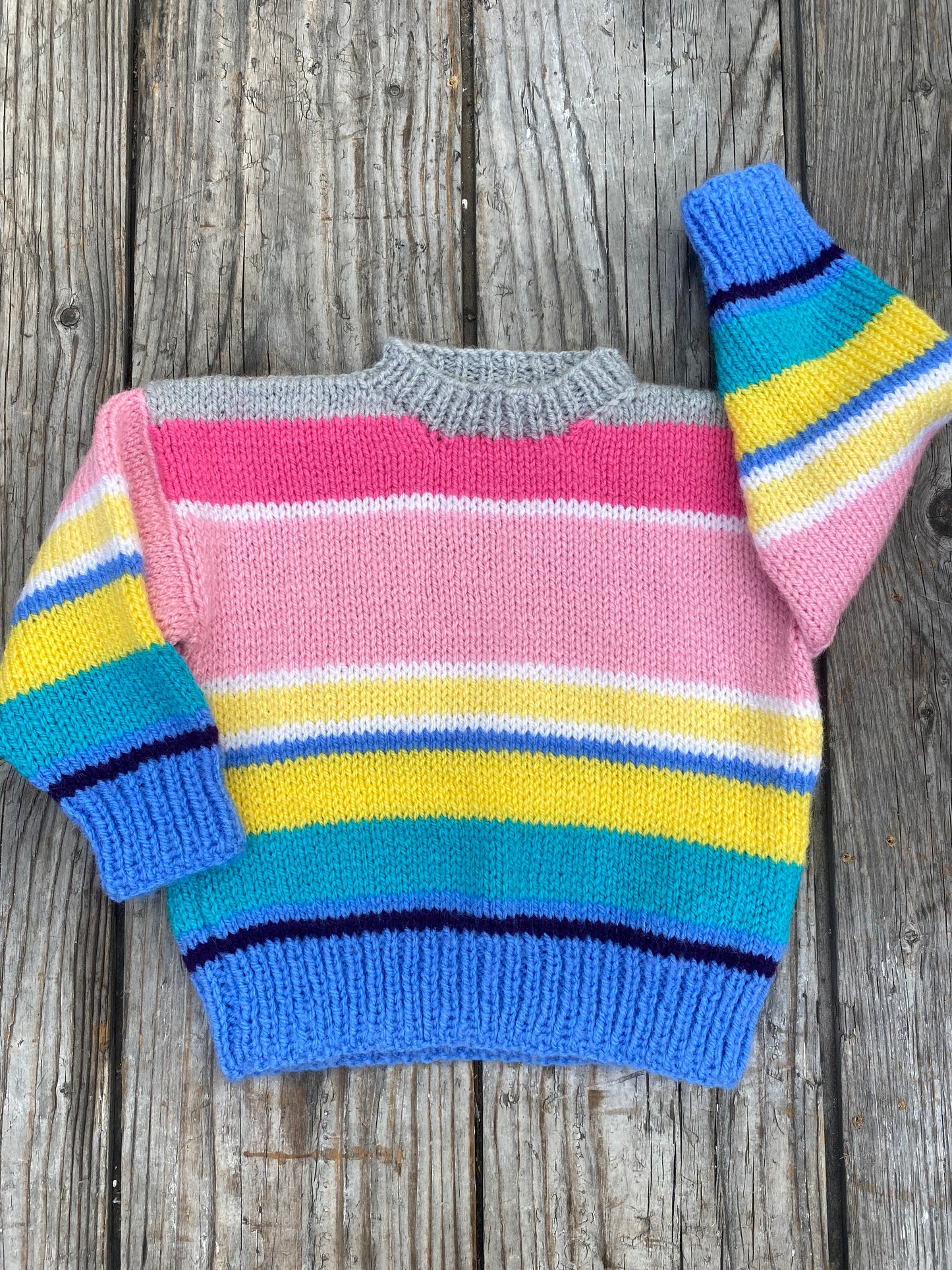 Rainbow stripe jumper (12-18 months)