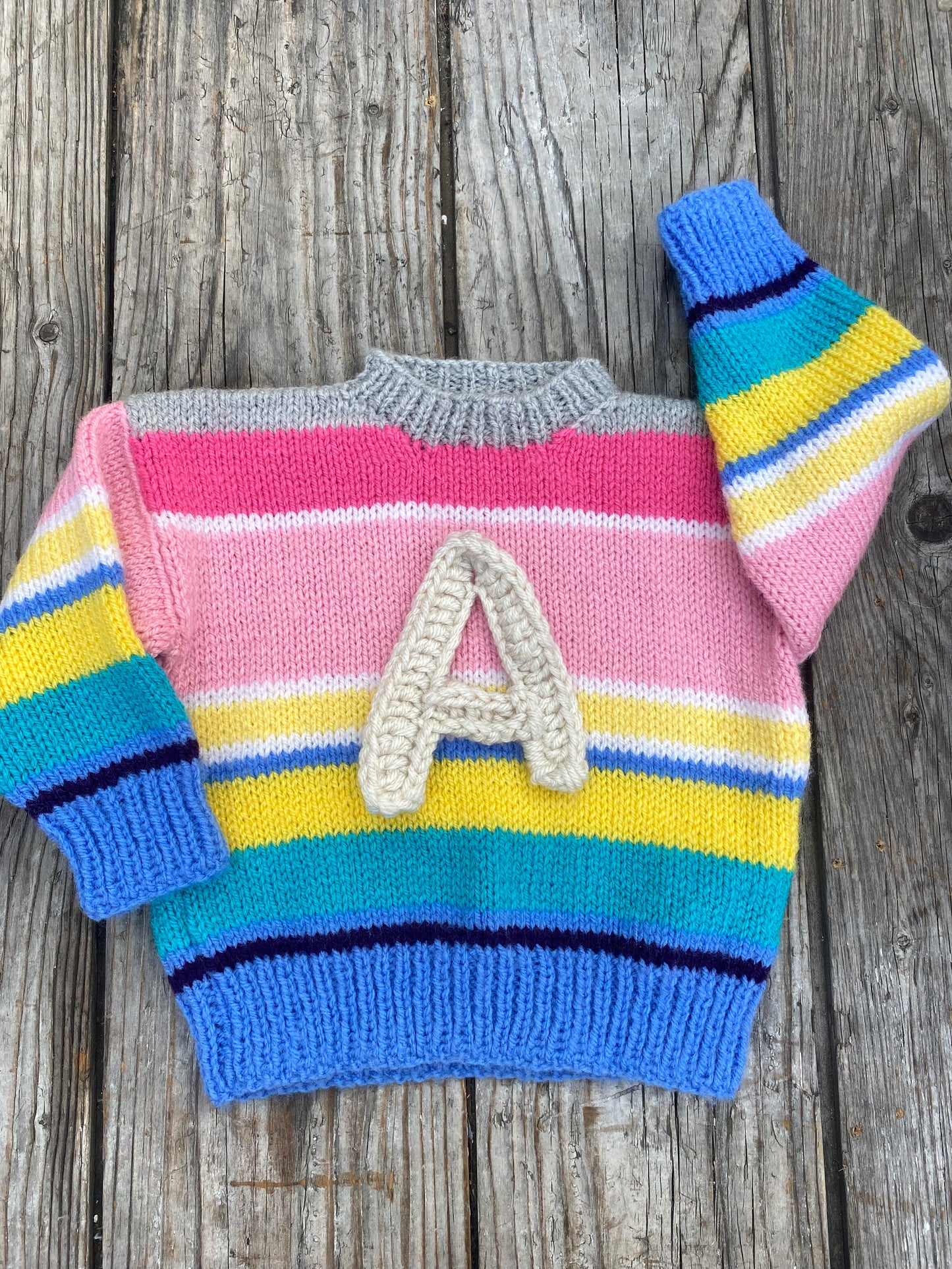 Rainbow stripe jumper (12-18 months)