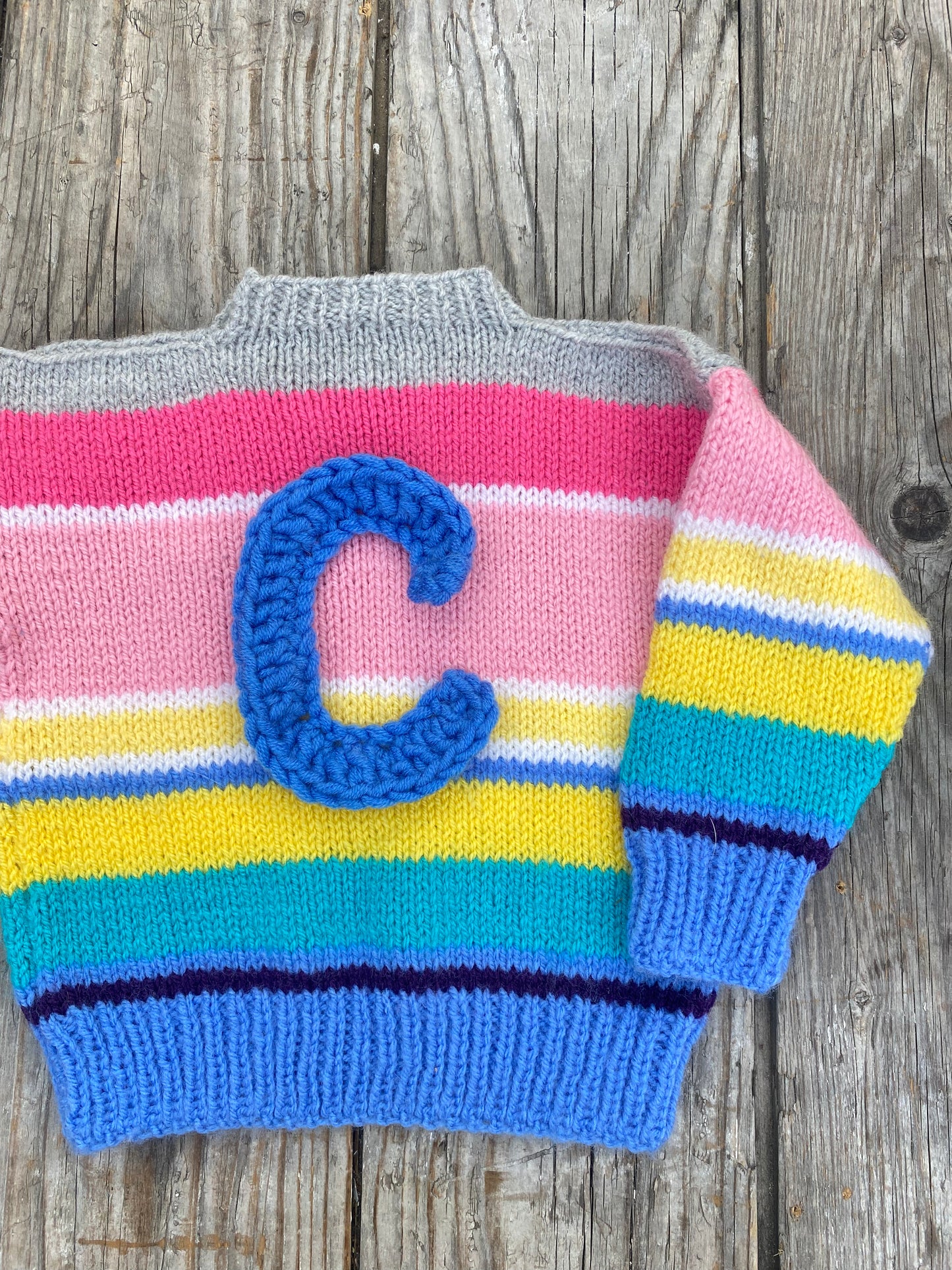 Rainbow stripe jumper (12-18 months)
