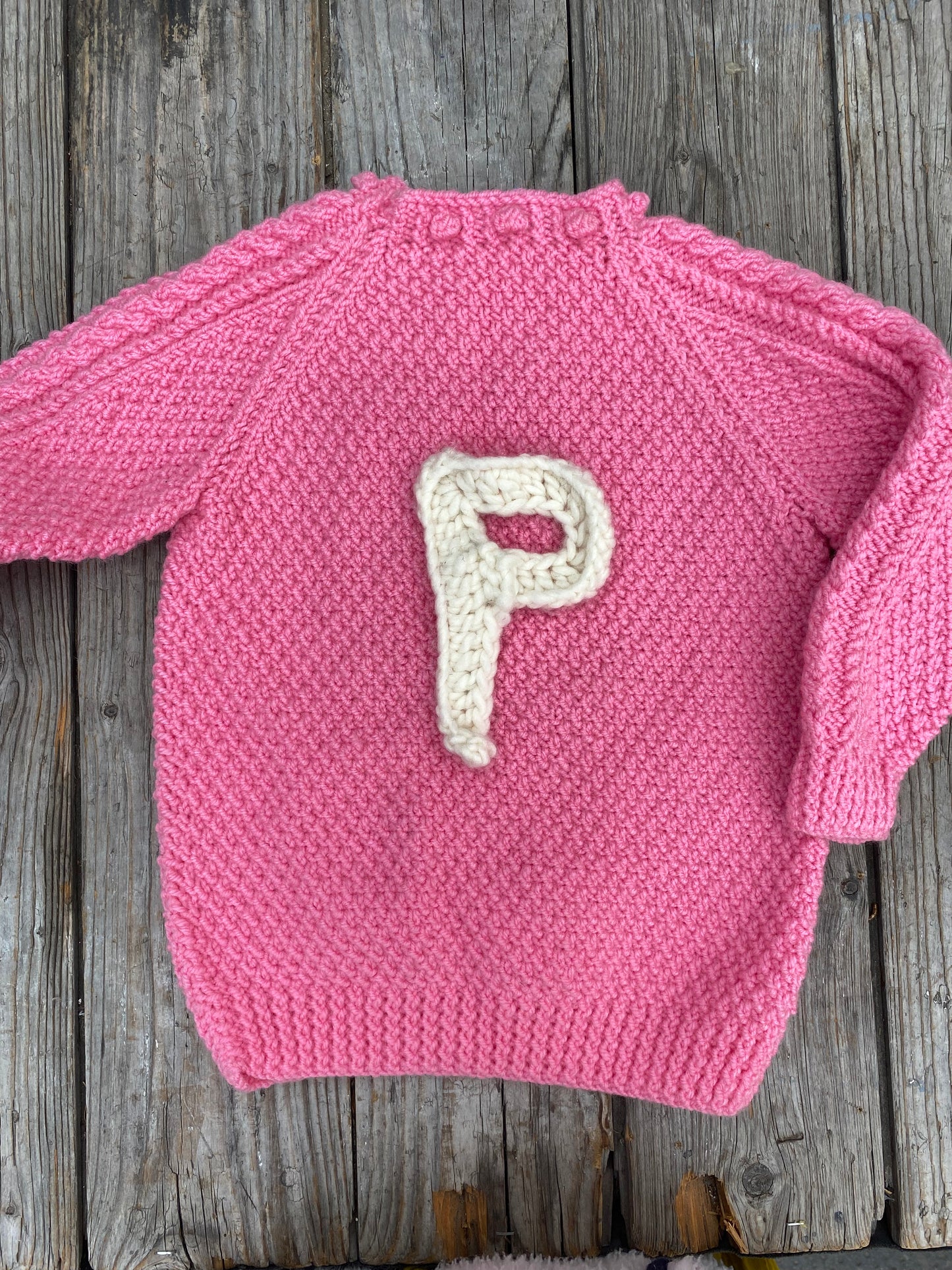 Bright pink chunky cable jumper (5-6 years)