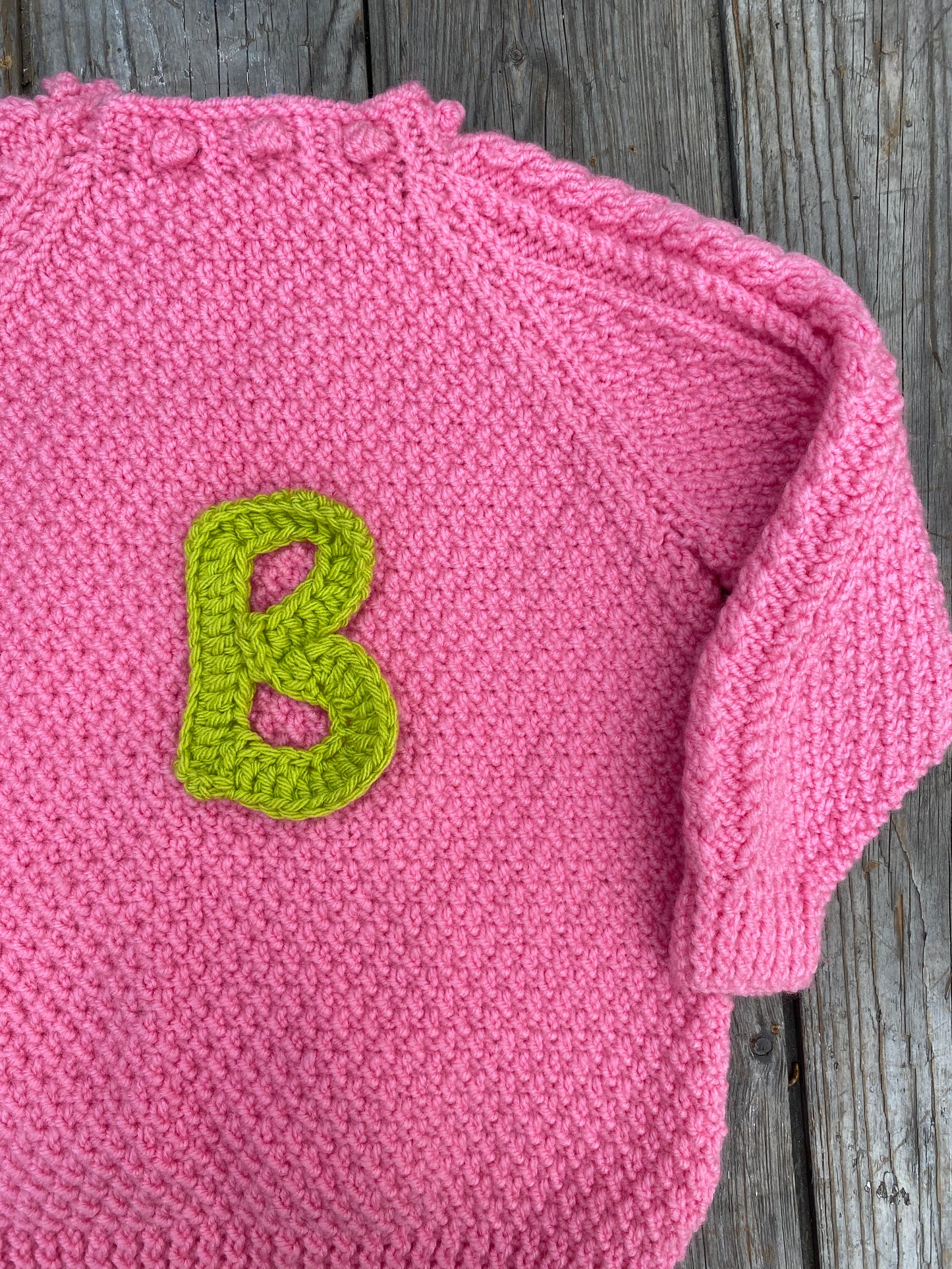 Bright pink chunky cable jumper (5-6 years)