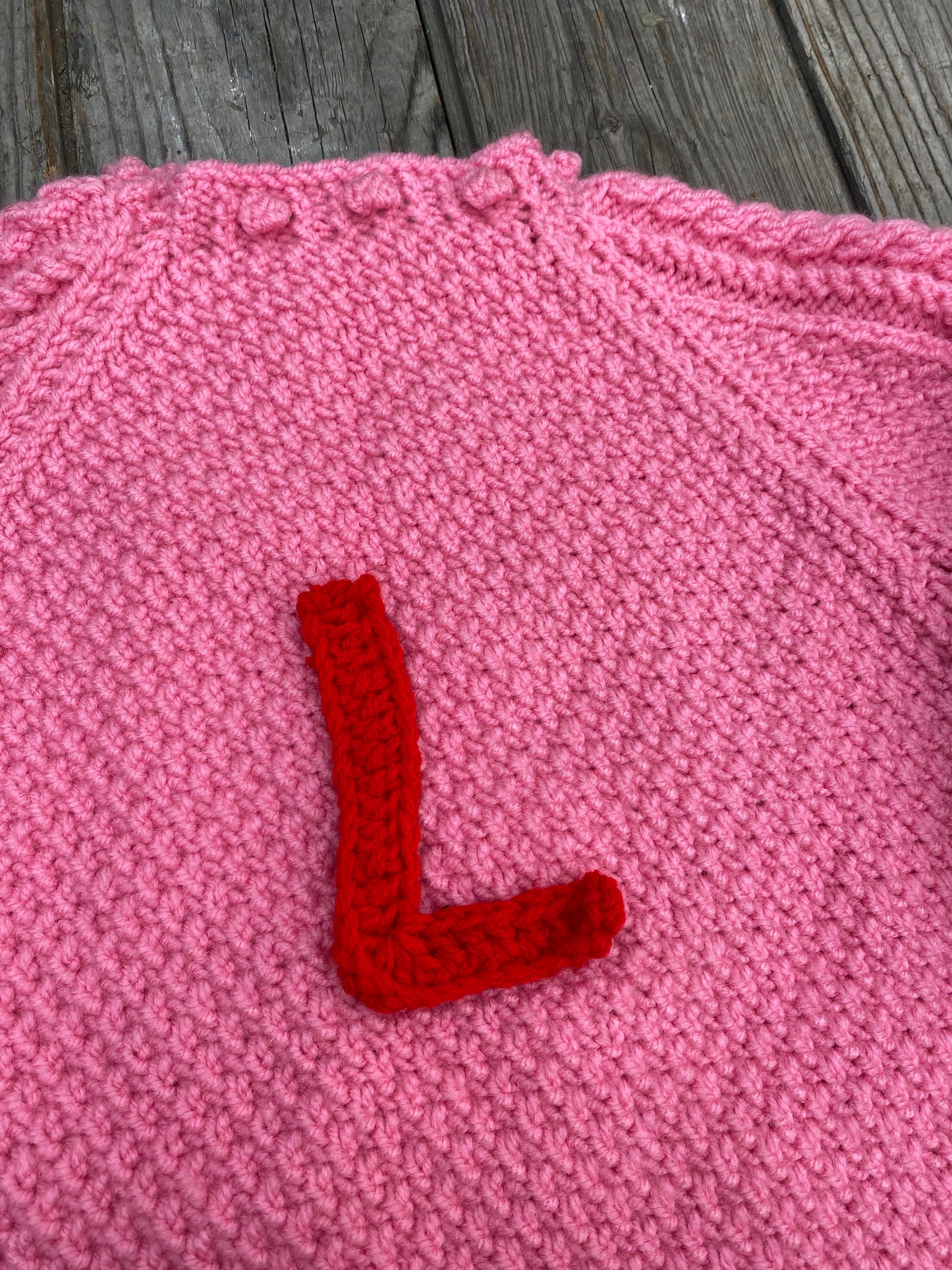 Bright pink chunky cable jumper (5-6 years)